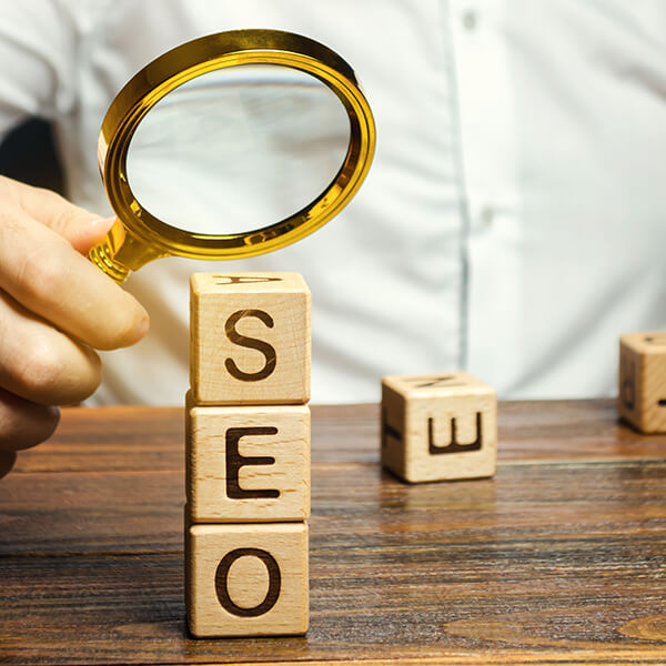 Blocks with word seo and magnifying glass
