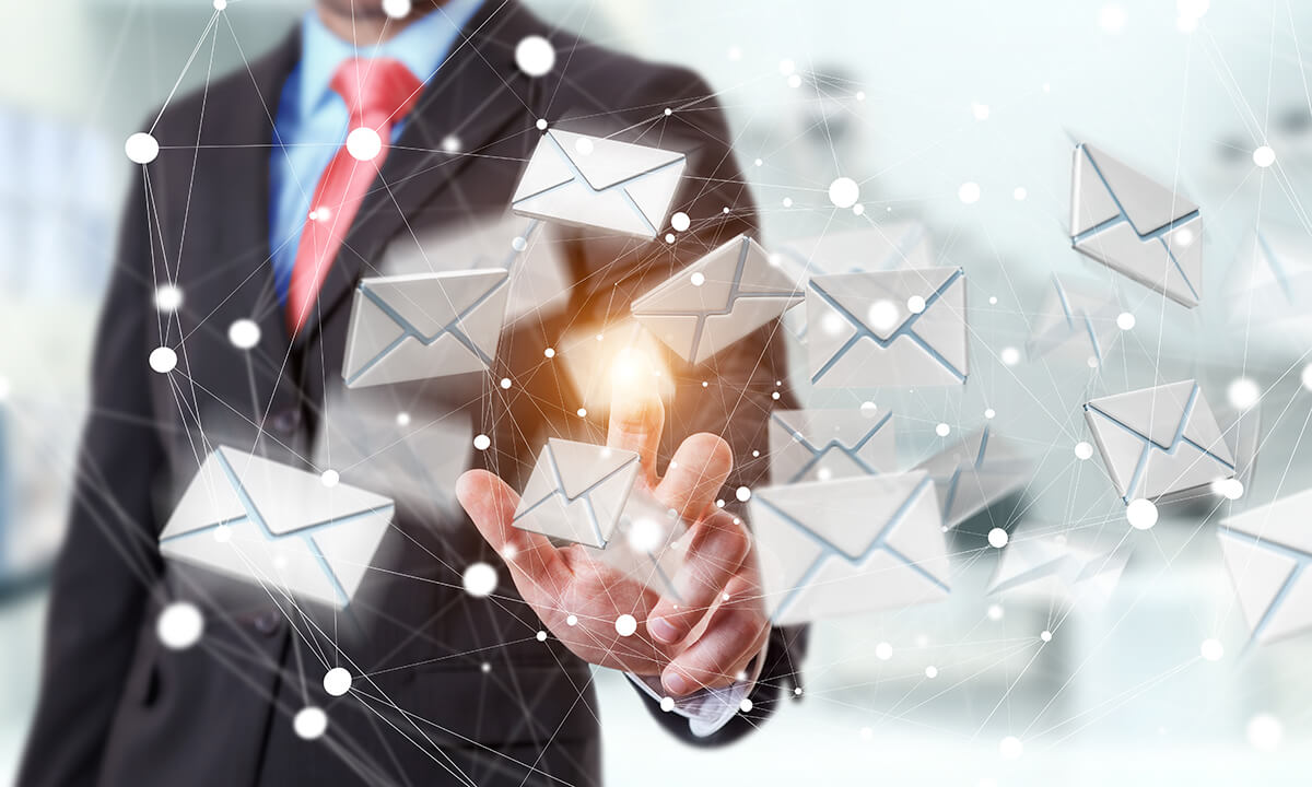 Businessman touching flying email icon with his finger